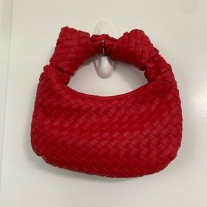 Red woven clutch bag from Belk.